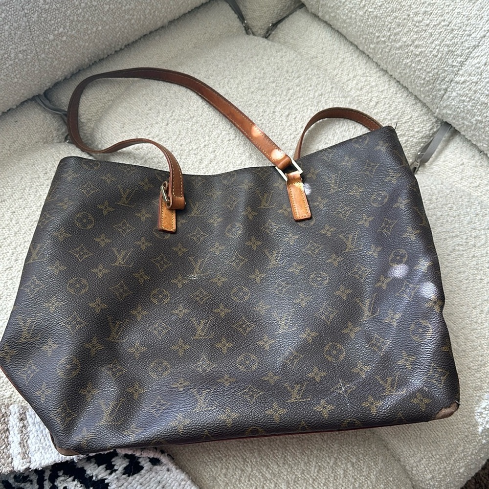 Damaged vintage Louis Vuitton bag